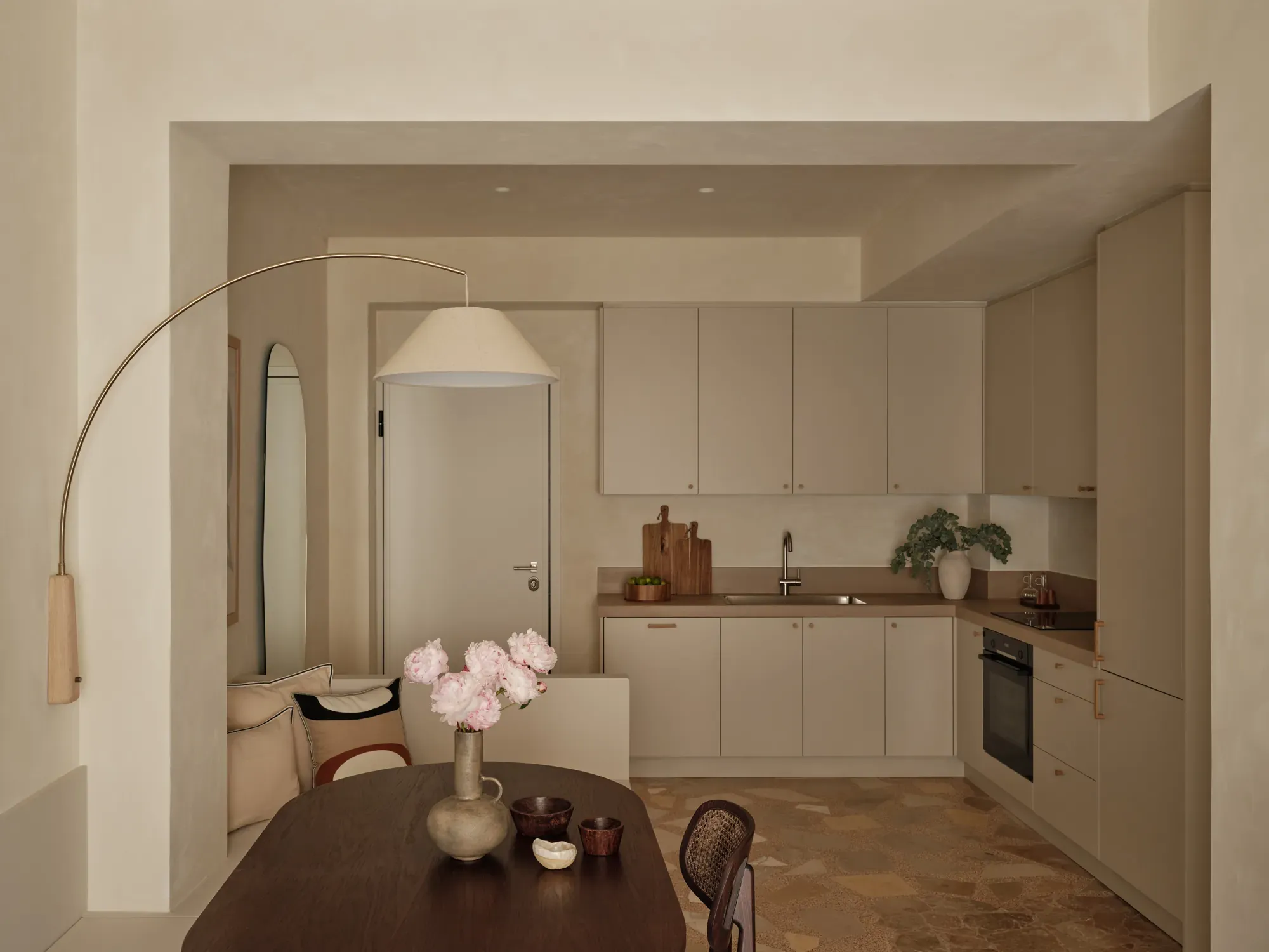 Living and dining spaces in a renovated 1960s apartment in Thiseio, Athens