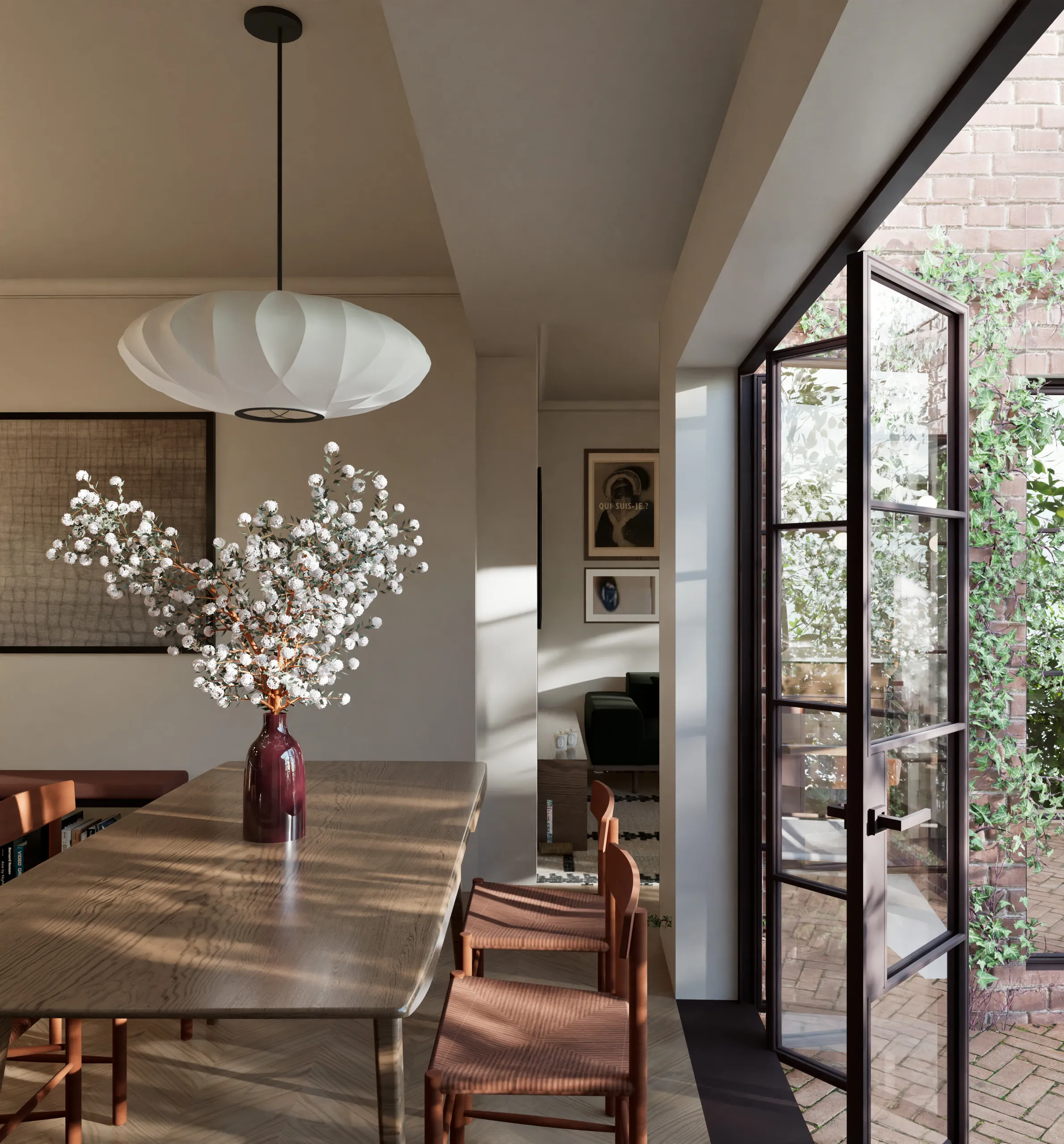 Dining room opening onto the planted garden through dark-framed glazed doors